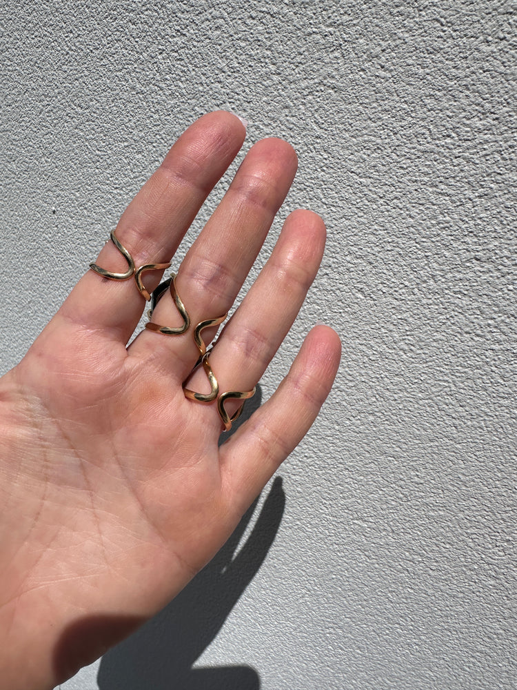 
                  
                    Labradorite Gold Arc Rings
                  
                